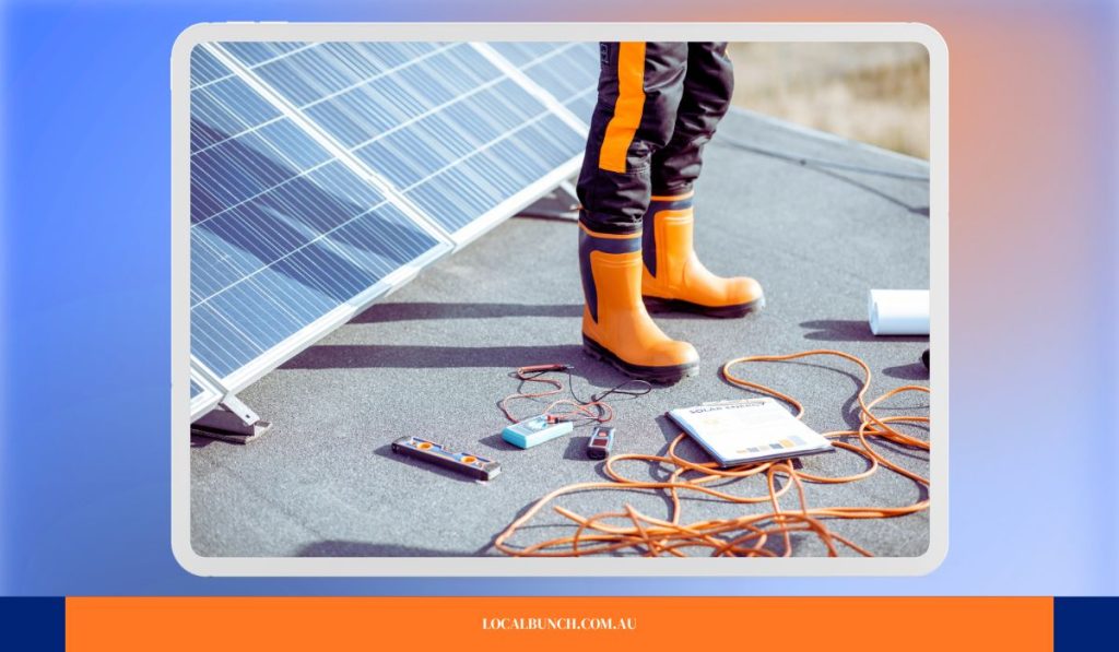 Image showing a solar installer standing over loose solar cables